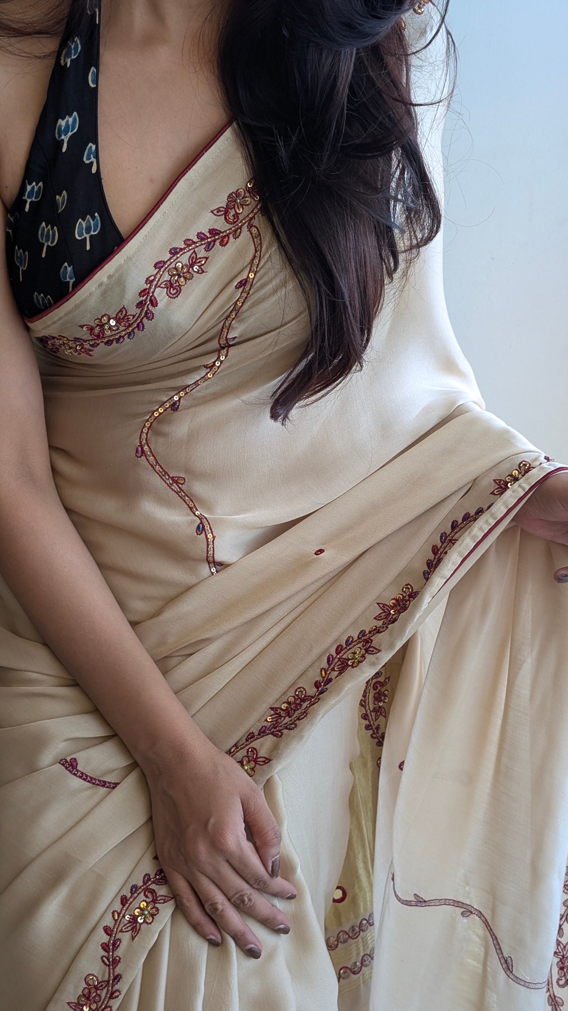 therangbhoomi wearing a cream ivory saree with intricate red embroidery