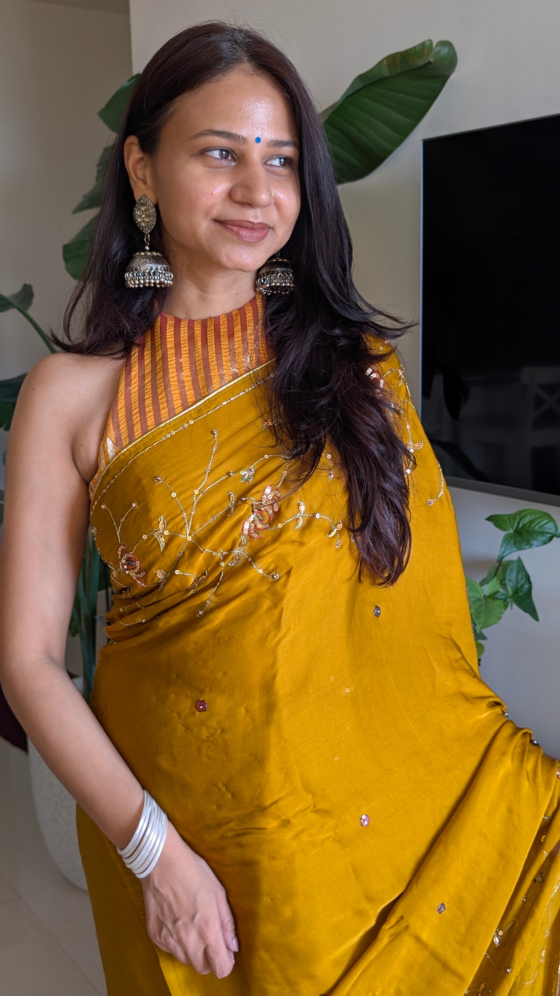 Modal silk saree with handwork in mustard yellow from therangbhoomi collection with hand embroidery