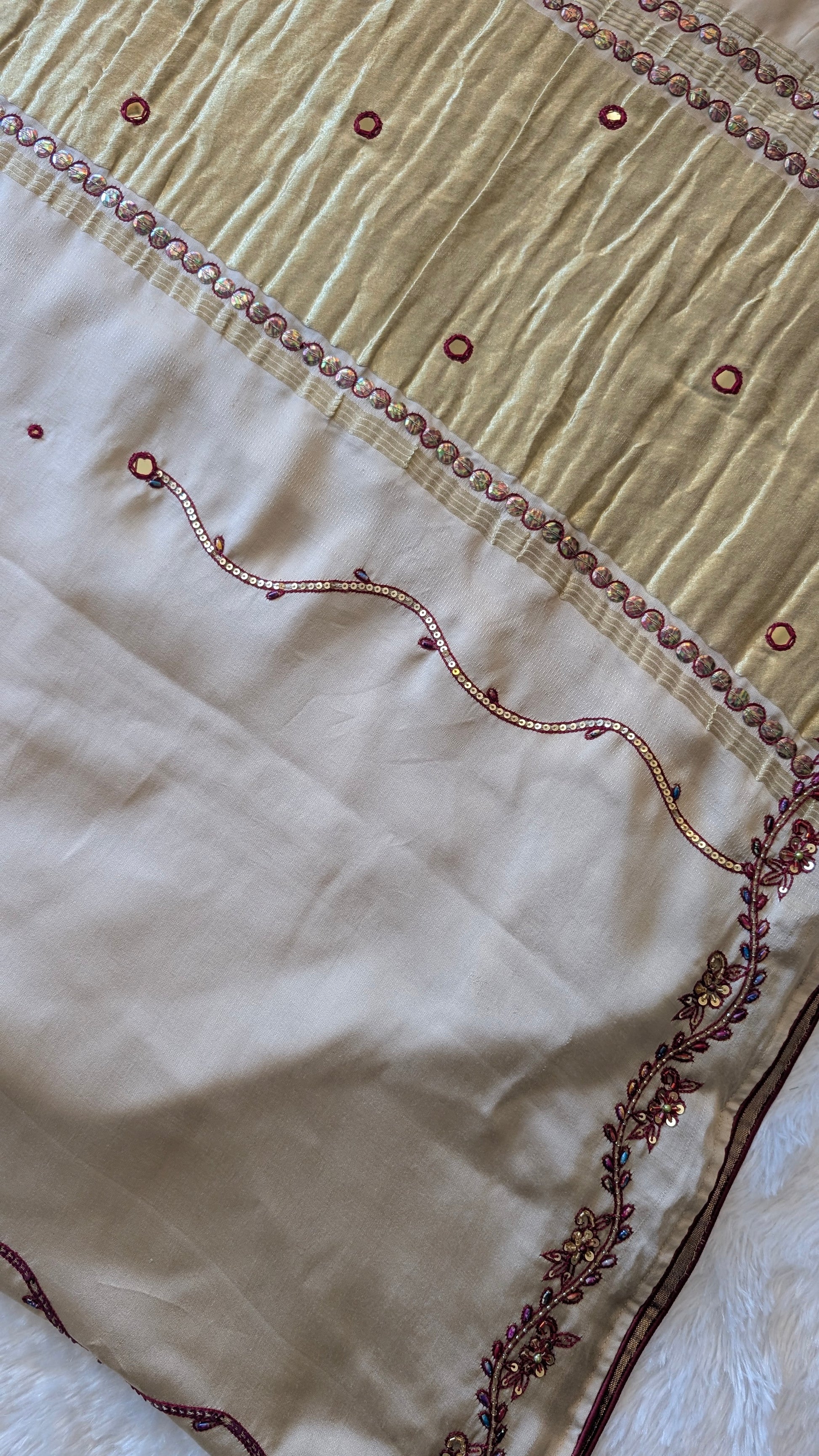 Close up embroidery and tissue pallu ivory saree
