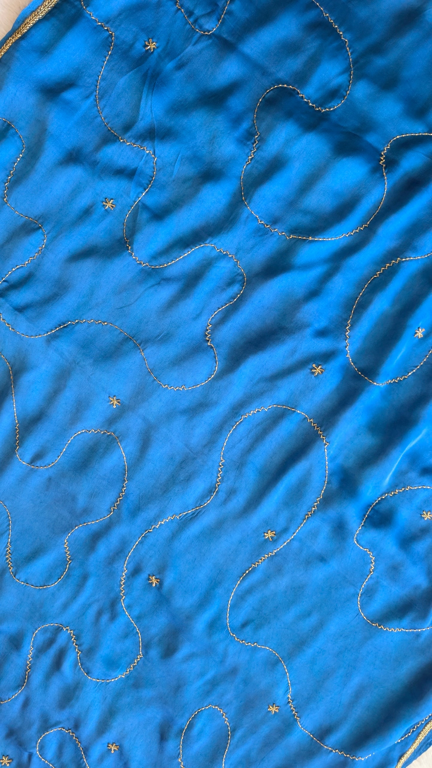 Blue modal silk saree with gold embroidery design