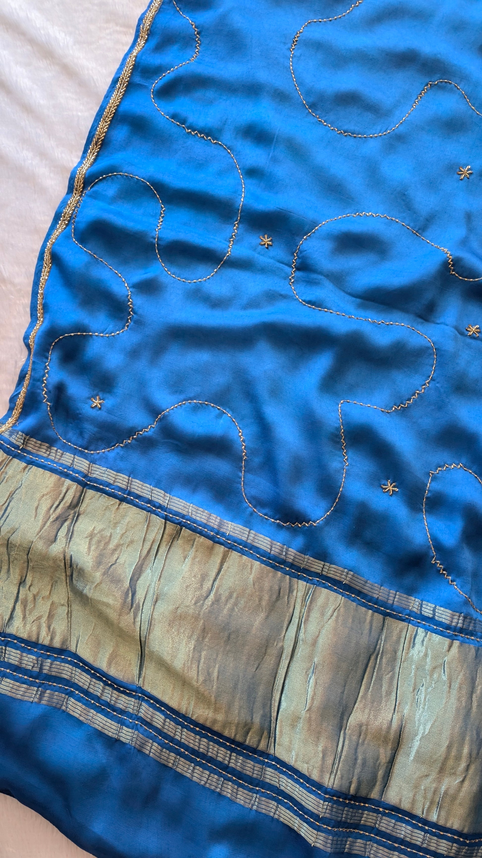 Blue modal silk saree with gold embroidery with tissue pallu